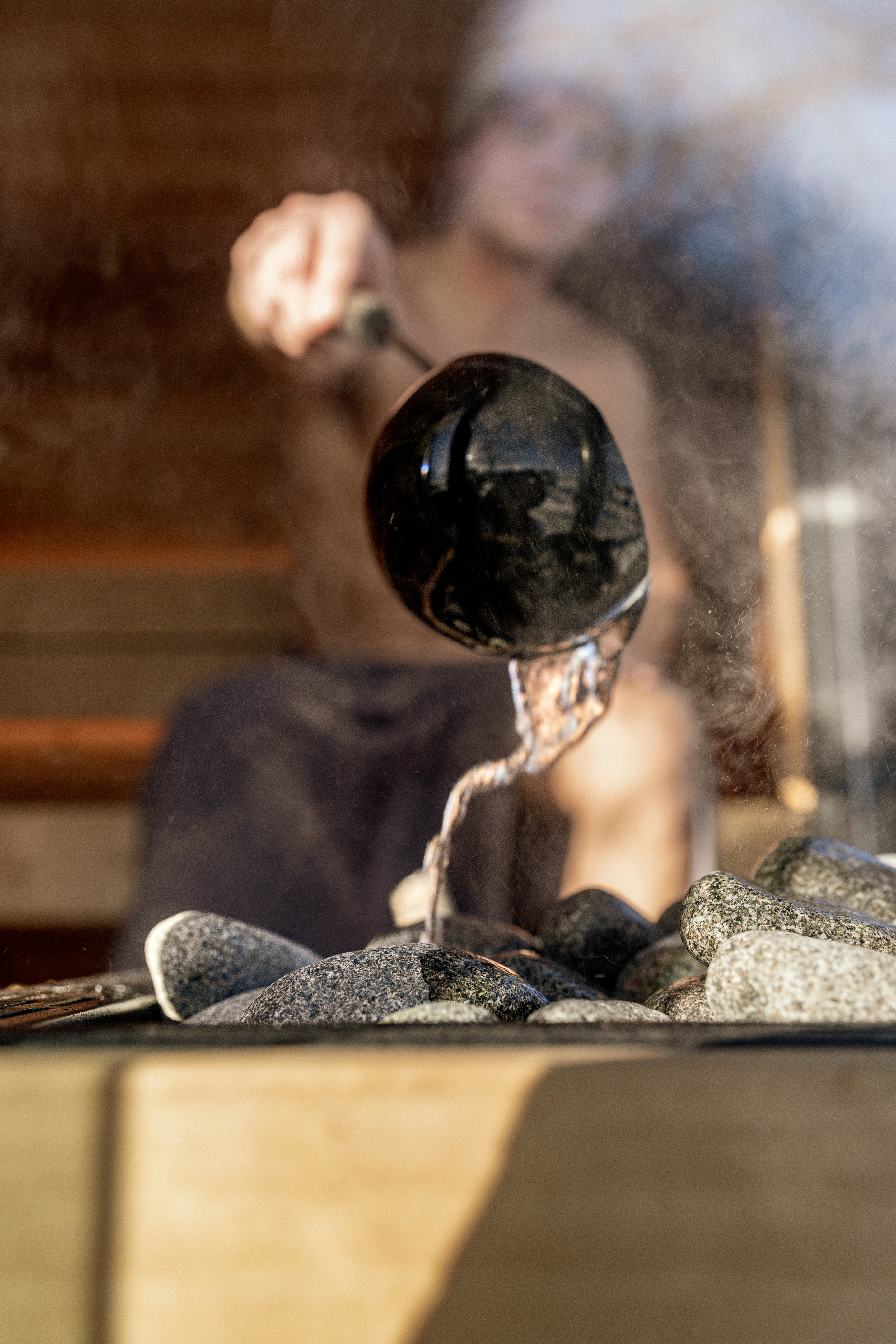 Water poured over hot sauna stones